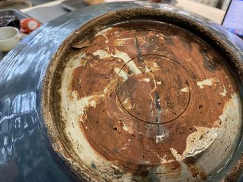 A Chinese monochrome blue Swatow dish with incised carp design, Ming